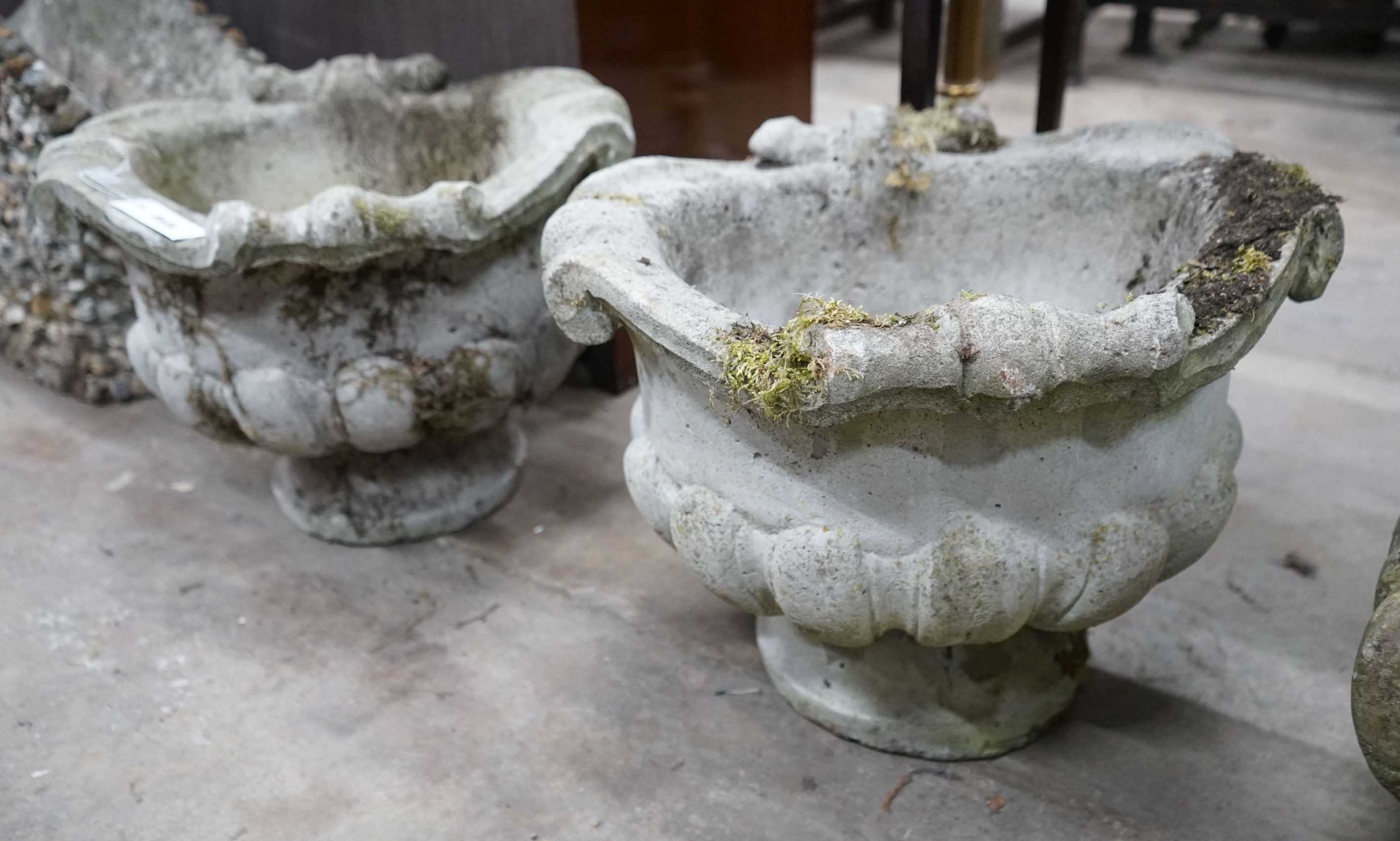 A pair of circular reconstituted stone fluted garden planters, diameter 52cm, height 39cm